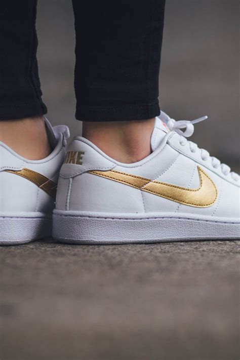 gold and white sneakers